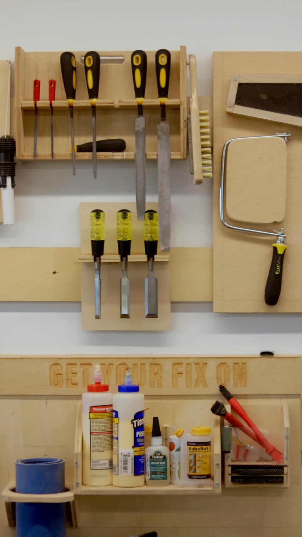 Woodworking hand tools hanging on a workshop wall